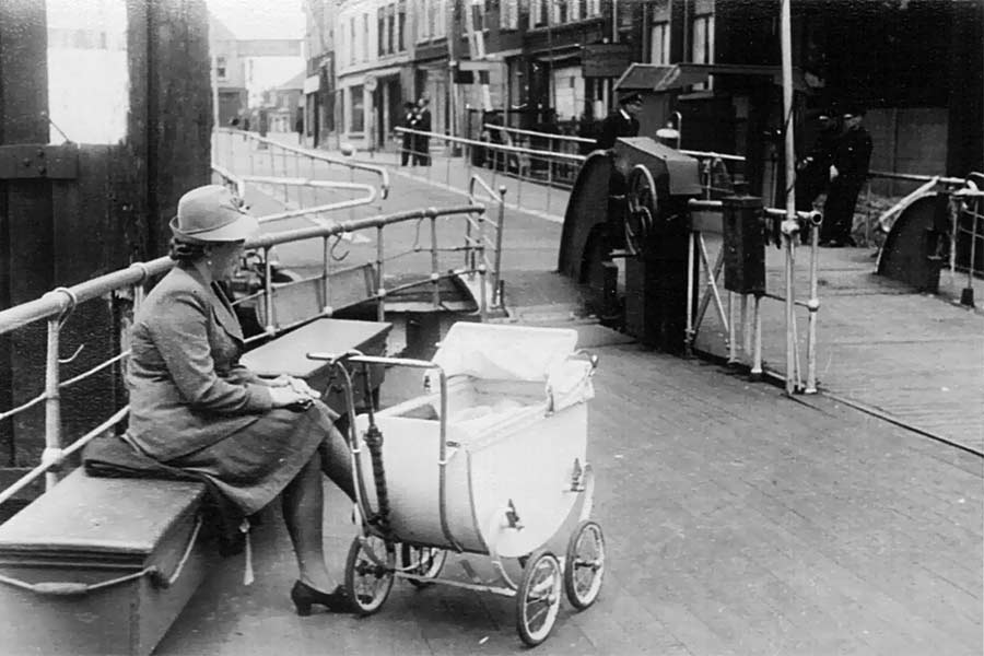 Waiting for the ferry to Dordrecht with my mom during World War II.